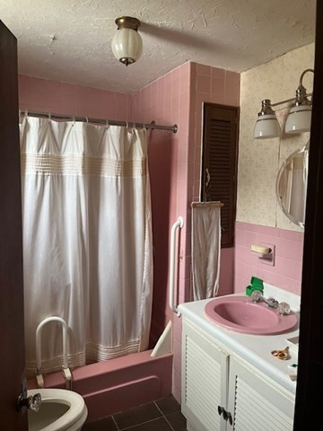 8 Grove Street Ayer, MA 01432 - Photo 6 of 20 a bathroom with a sink a mirror and shower