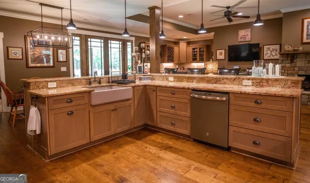 a kitchen with stainless steel appliances granite countertop a stove and cabinets