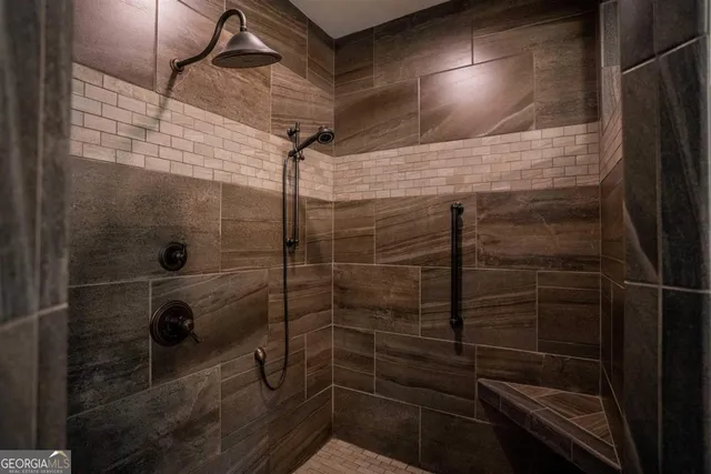 a room with furniture a flat screen tv and large window