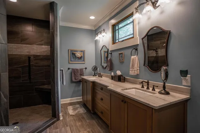 a room with furniture a bookshelf and a window