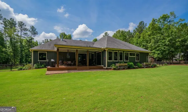 a front view of a house with garden and porch