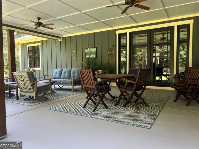 a bedroom with furniture and a gym equipment