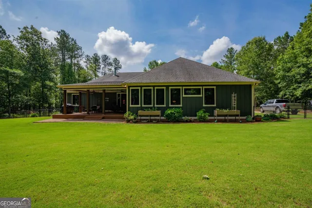 a front view of a house with garden