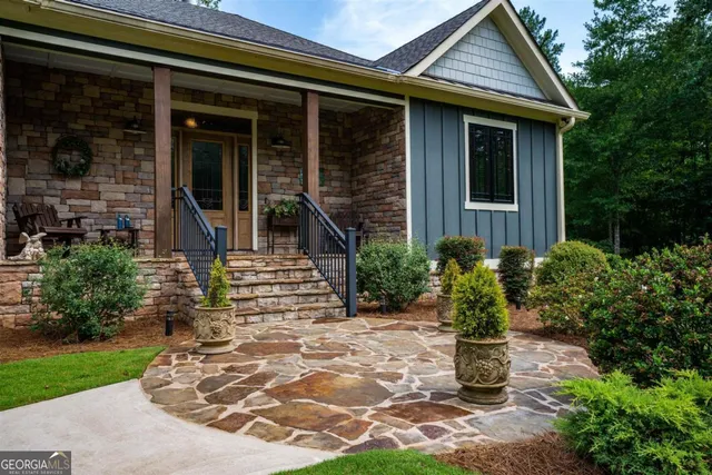 a front view of a house with garden