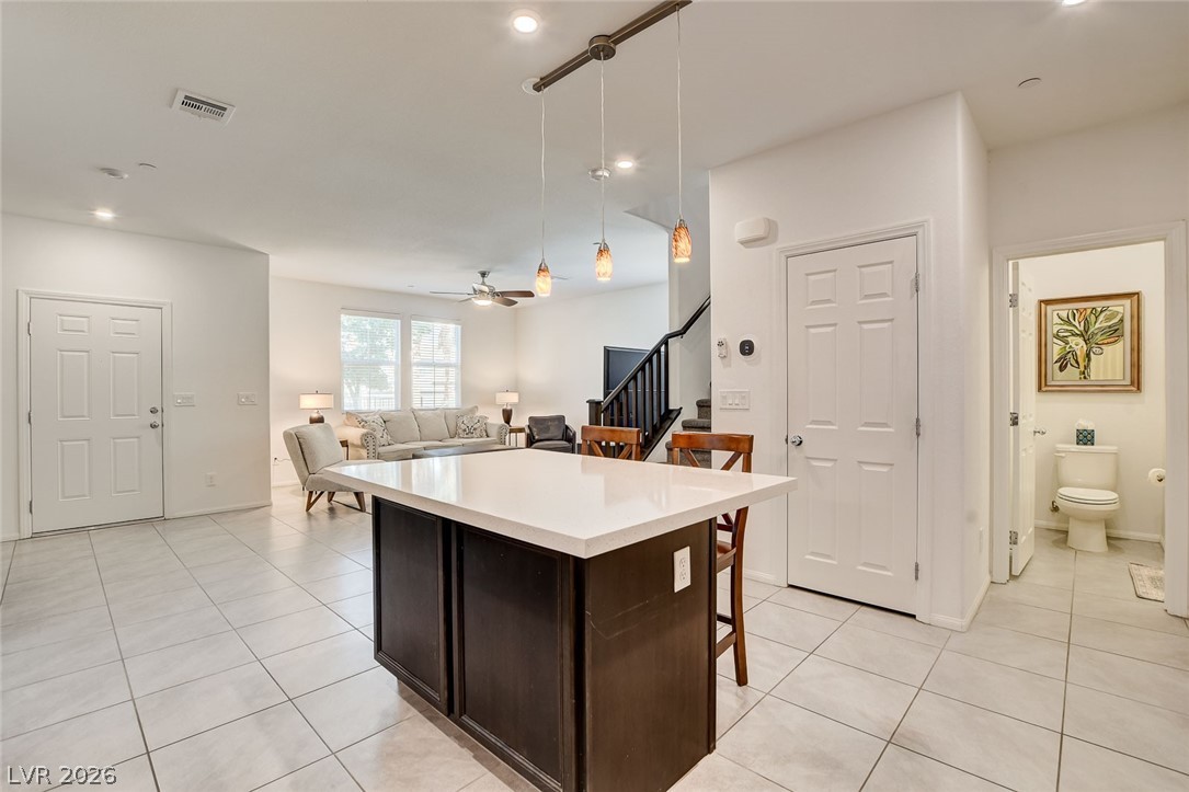 484 Filaree Place Henderson, NV 89015 - Photo 22 of 71 This bright and airy living space seamlessly connects kitchen and living areas for modern living.