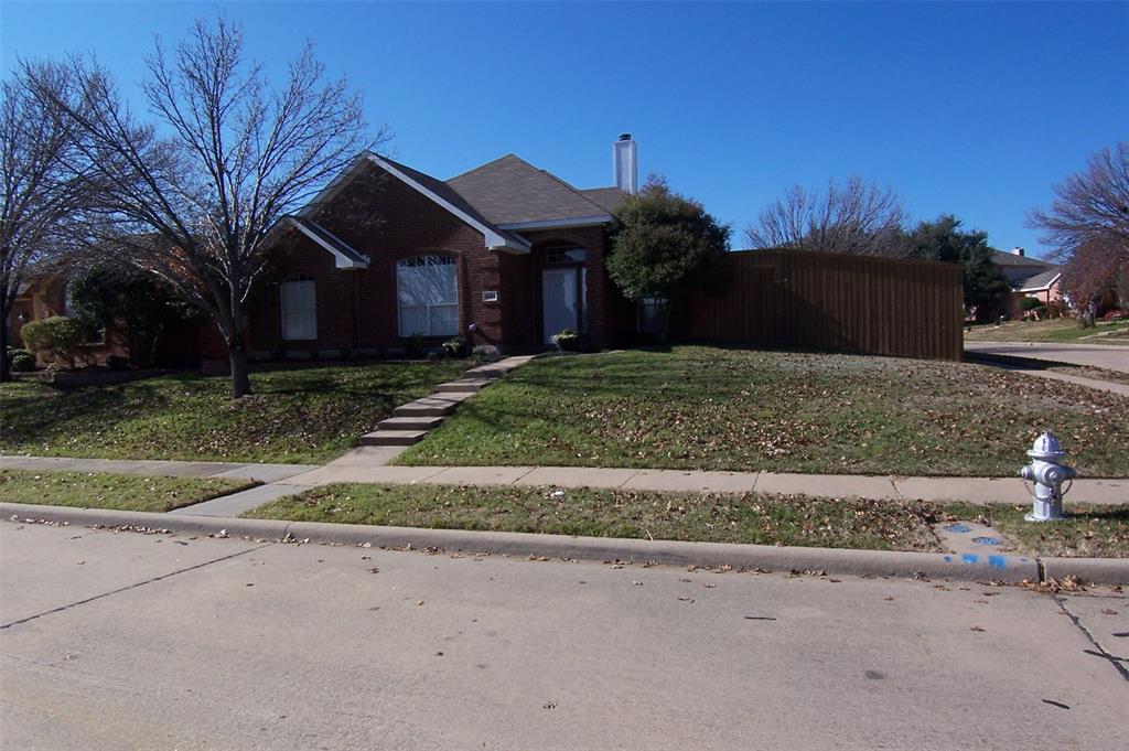 8301 Bells Street Frisco, TX 75035 - Photo 1 of 24 a front view of a house with a yard and garage