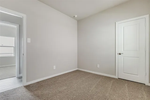 an empty room with closet area