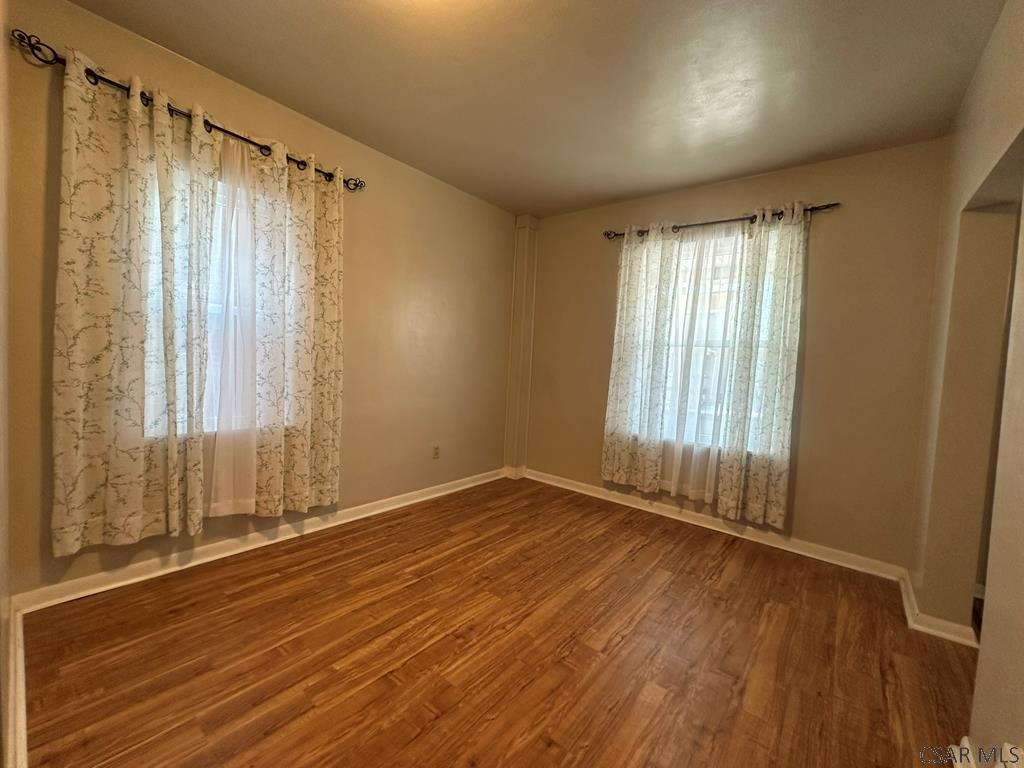 312 12th Street Windber, PA 15963 - Photo 9 of 24 a view of an empty room with wooden floor and a window