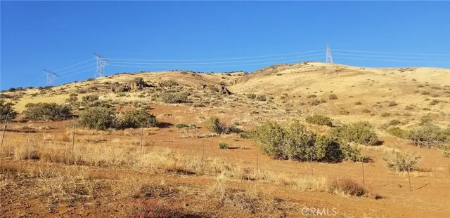 a view of a mountain range with trees in the background