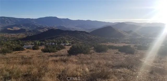 a view of mountain view with mountains in the background