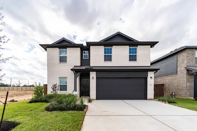 a front view of a house with yard