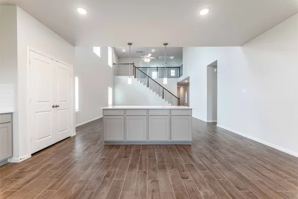 a view of entryway and hall with wooden floor