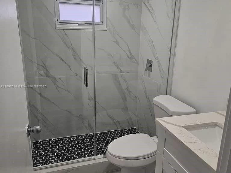 Flagami Miami, FL 33144 - Photo 3 of 14 a white toilet sitting next to a bathroom sink