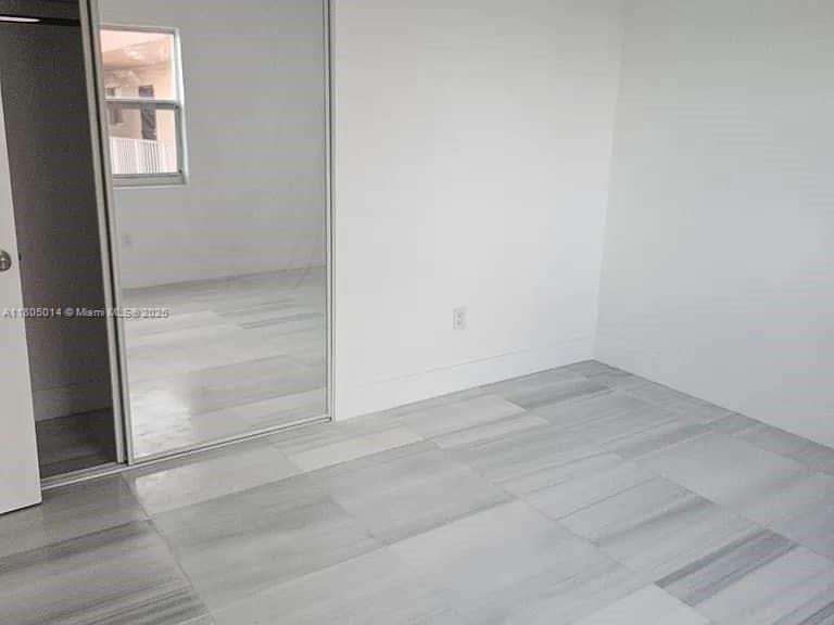 Flagami Miami, FL 33144 - Photo 9 of 14 an empty room with wooden door