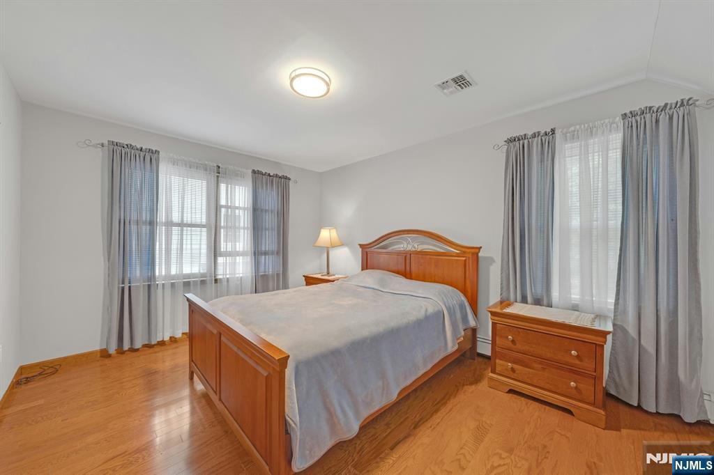 24 Cambridge Road Tenafly, NJ 07670 - Photo 19 of 31 a bedroom with a bed and a window