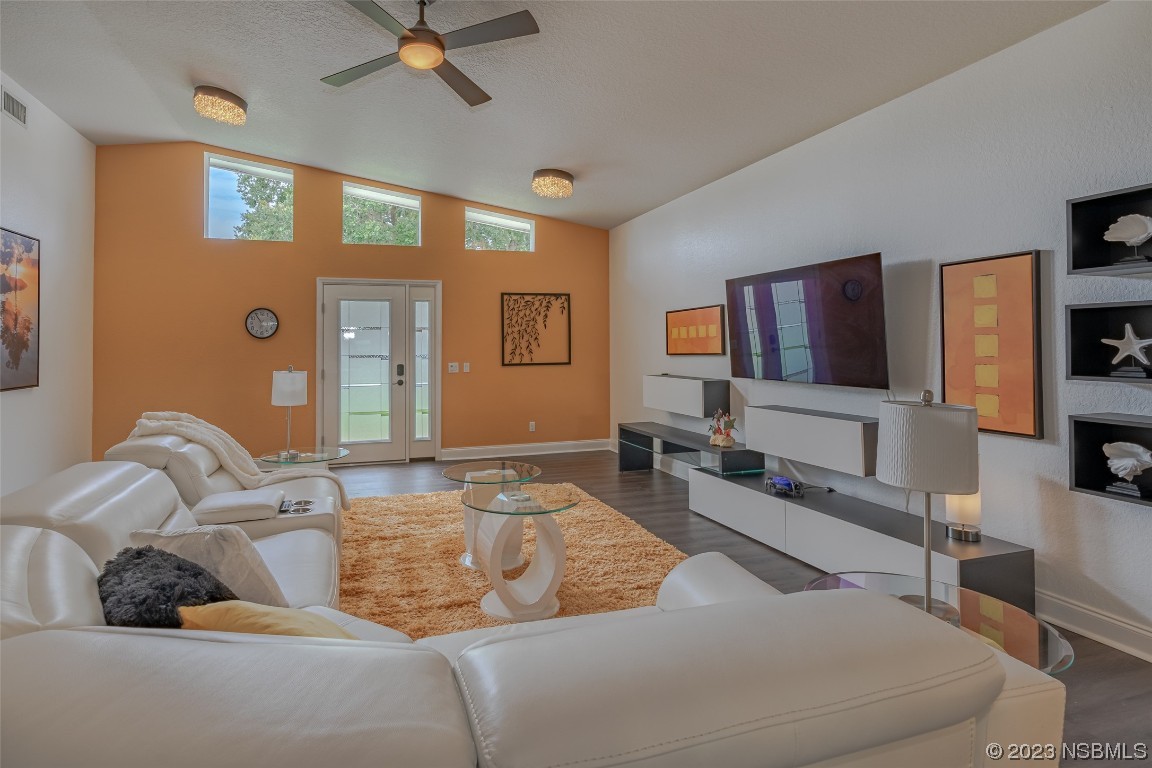 Undisclosed Address Edgewater, FL 32141 - Photo 15 of 34 a living room with furniture and a flat screen tv