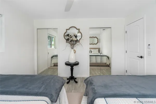 a living room with a couch and chandelier