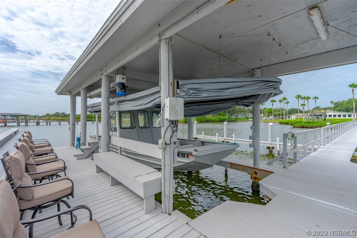 Undisclosed Address Edgewater, FL 32141 - Photo 32 of 34 a view of a patio with couches table and chairs with wooden floor