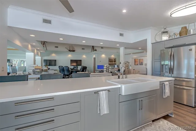 a kitchen with sink cabinets and appliances