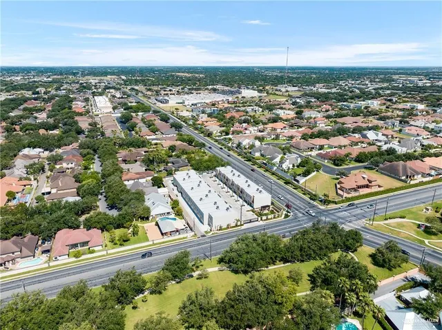 an aerial view of residential houses with outdoor space