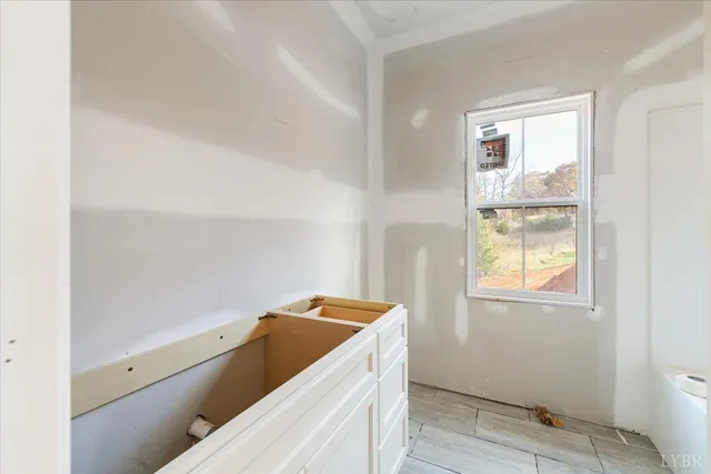 a view of an empty room with a window