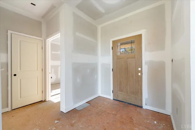 an empty room with closet and a bathroom