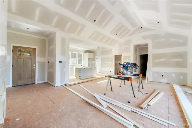 a view of a livingroom with furniture and a flat screen tv