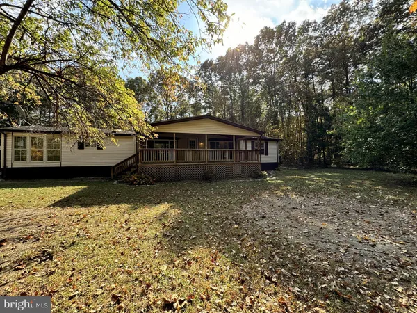 a house with trees in the background