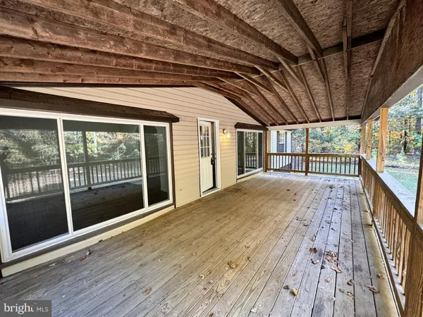 a view of hallway with wooden floor