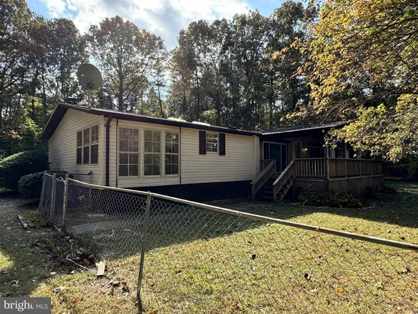 a house with trees in the background