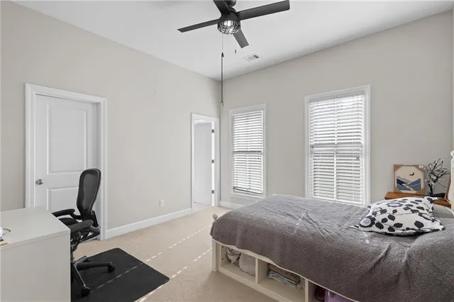 a bedroom with a bed and a table