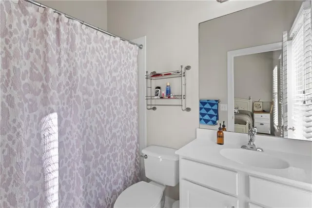 a view of a hallway with wooden floor and entryway