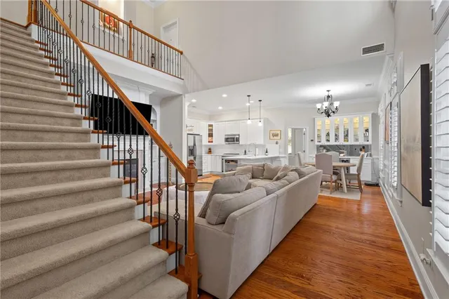 a living room with furniture oven and a dining table