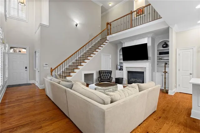 a living room with fireplace furniture and a flat screen tv