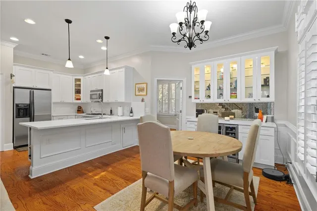 a large kitchen with a table and chairs