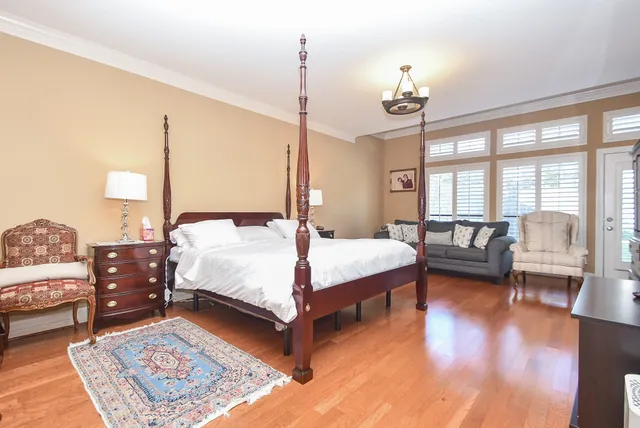 a bedroom with a bed and a fireplace