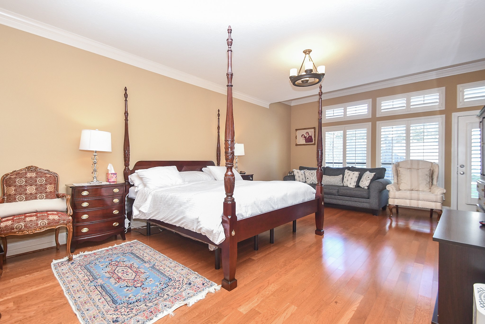 20102 Gable Point Drive Katy, TX 77450 - Photo 18 of 42 a bedroom with a bed couch and wooden floor
