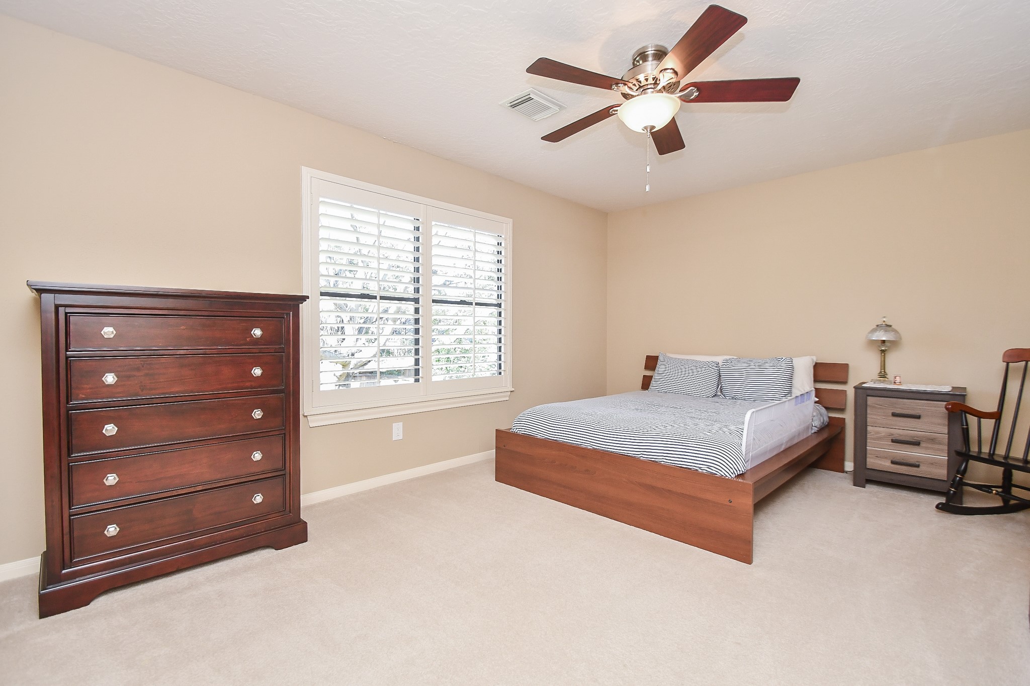 20102 Gable Point Drive Katy, TX 77450 - Photo 26 of 42 a spacious bedroom with a bed and a ceiling fan