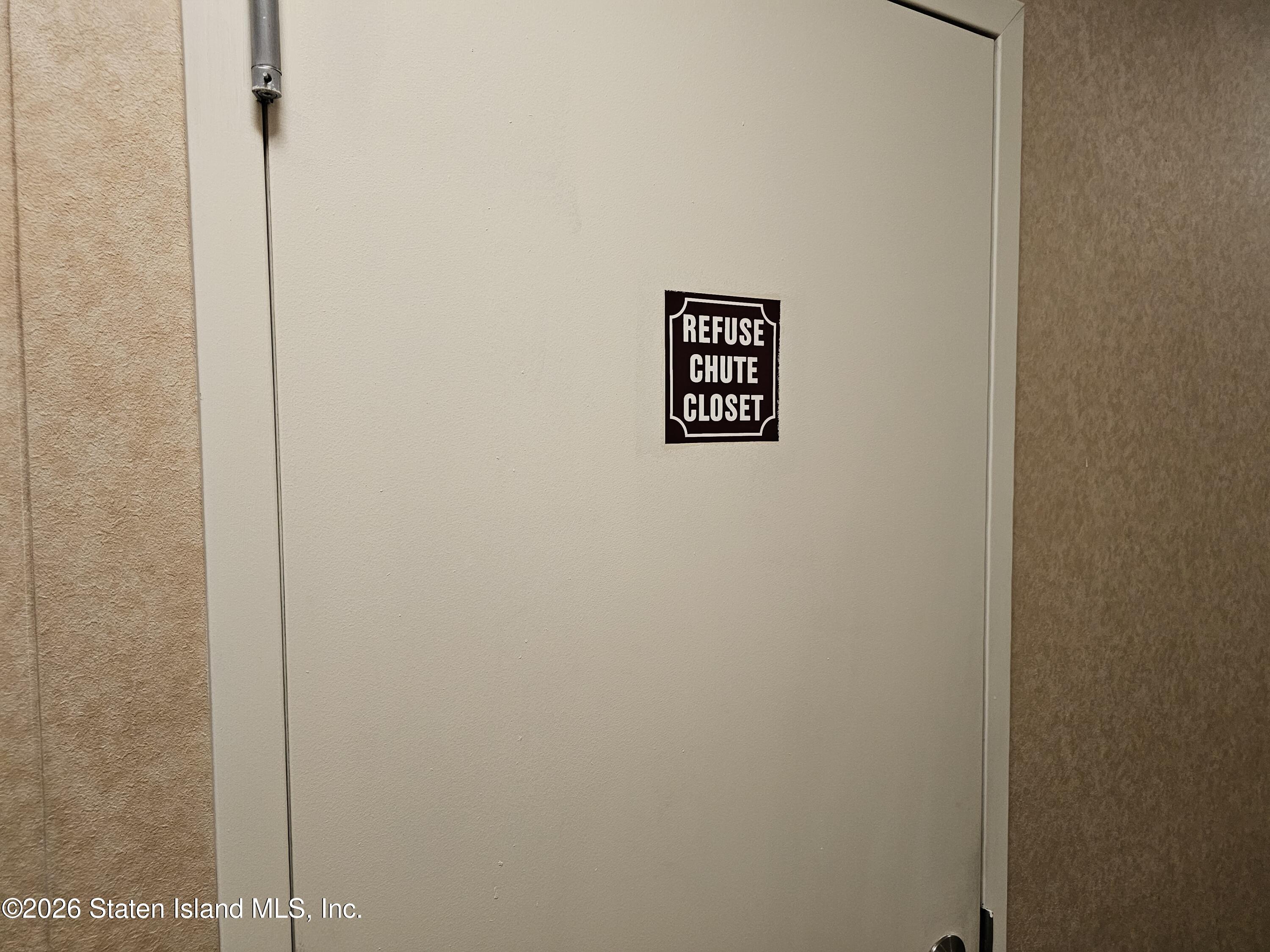 3871 Amboy Road, Unit 404 Staten Island, NY 10308 - Photo 14 of 17 a wall with a sign on it