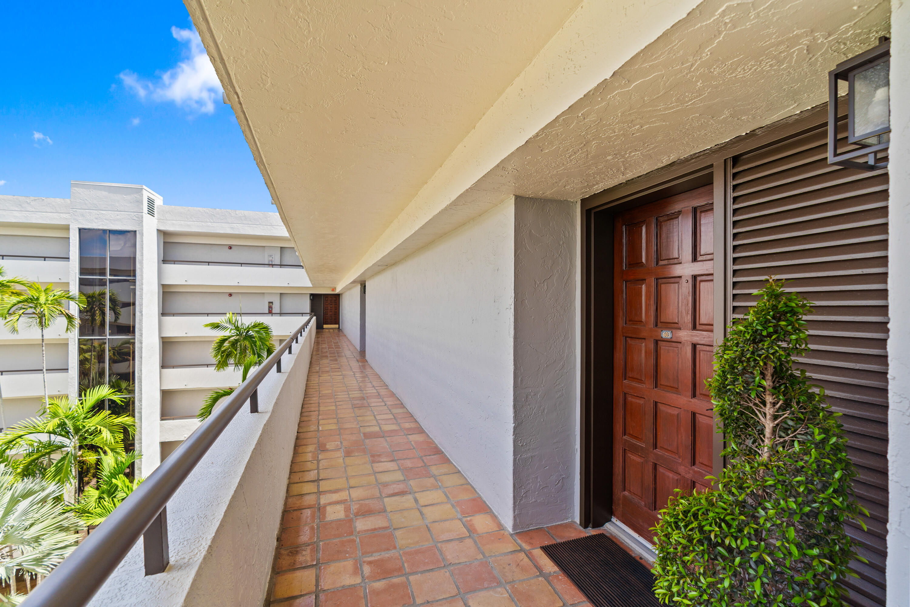 23200 Camino Del Mar, Unit 603 Boca Raton, FL 33433 - Photo 30 of 43 a view of a balcony with potted plants