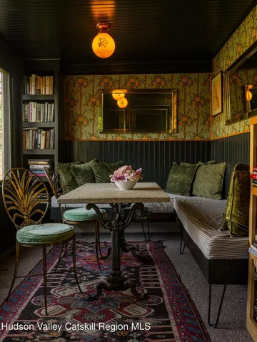 a living room with a couch and chandelier