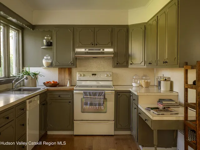 a view of a dining room with furniture and window