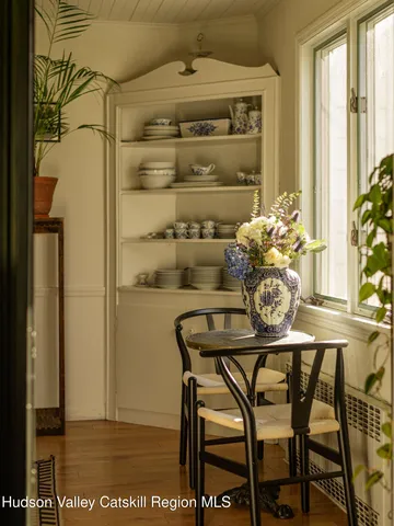 a living room with a couch and potted plant