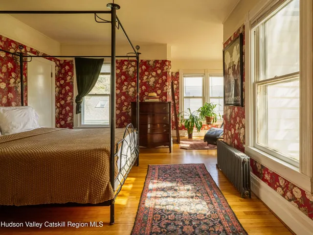 a bathroom with a tub and window