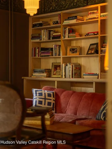 a living room with a couch and a dining table