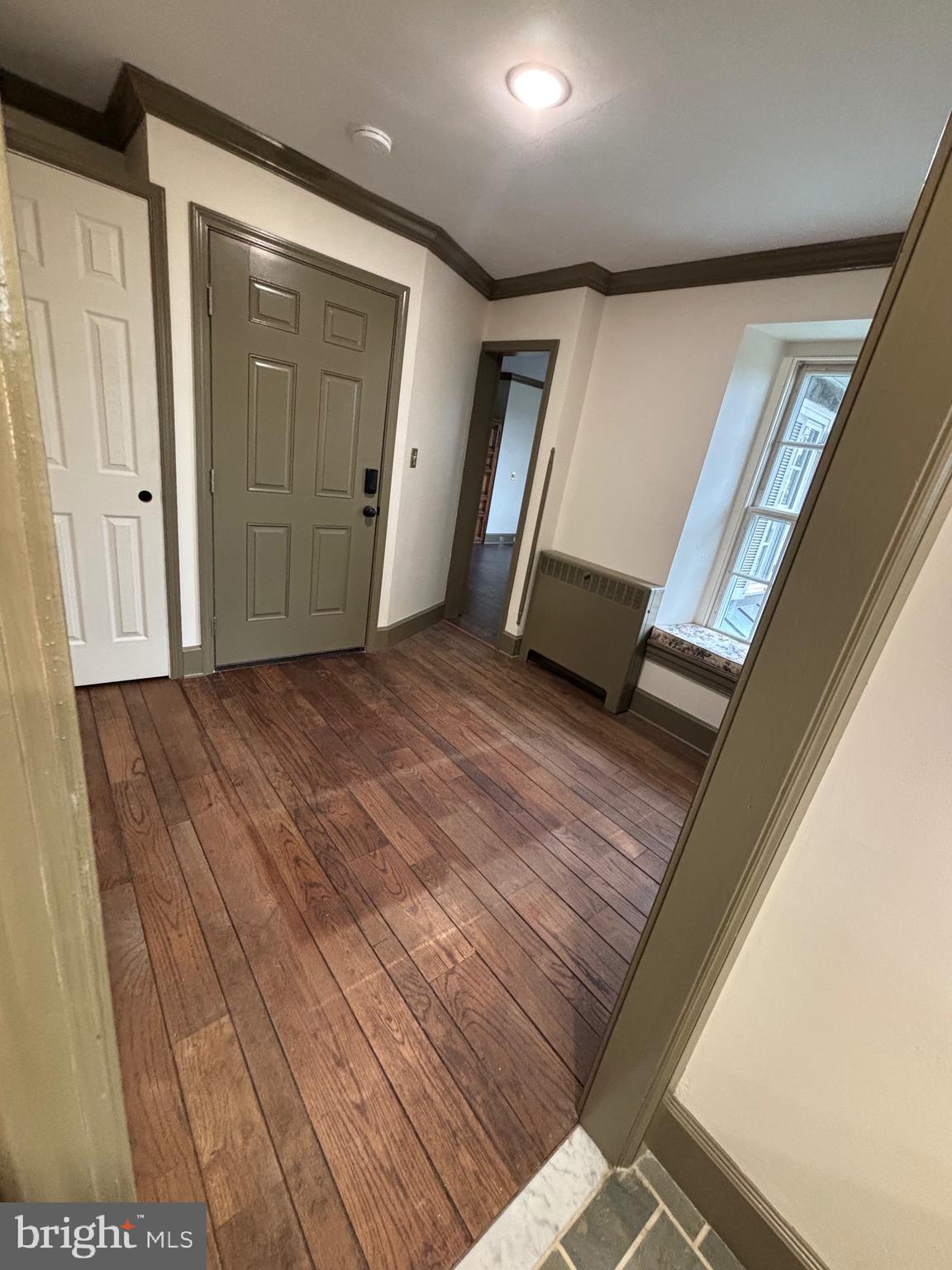 28 West Main Street, Unit 3 Elverson, PA 19520 - Photo 3 of 10 a view of an empty room with wooden floor