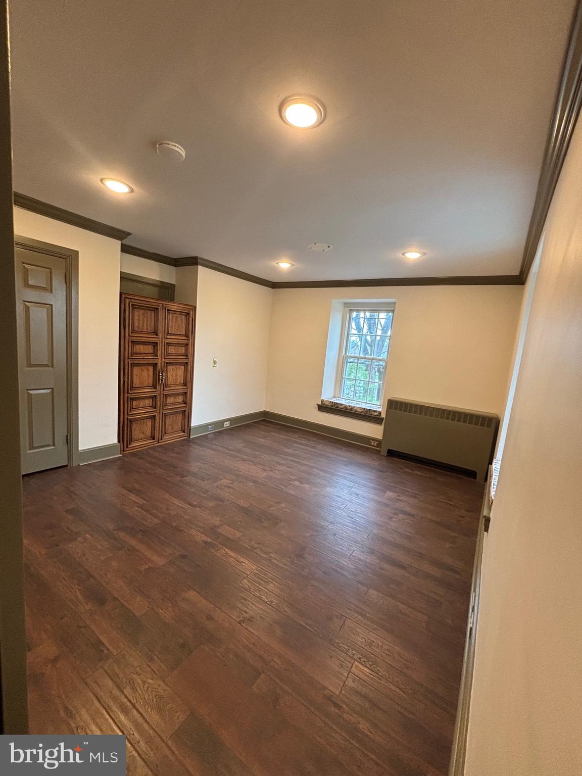 28 West Main Street, Unit 3 Elverson, PA 19520 - Photo 6 of 10 an empty room with wooden floor and windows