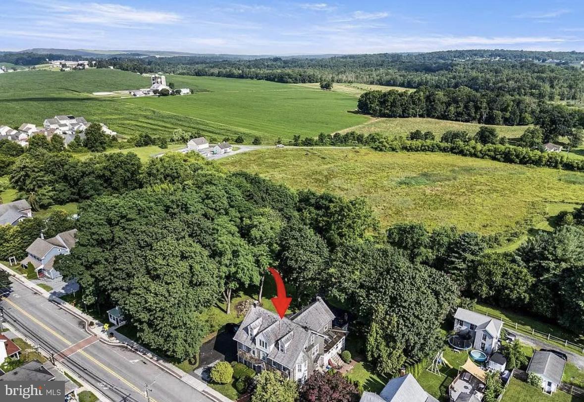 28 West Main Street, Unit 3 Elverson, PA 19520 - Photo 10 of 10 a view of a city with lush green forest