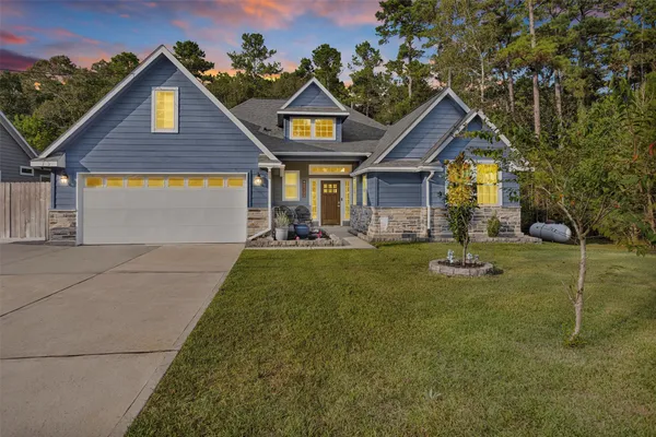 a kitchen with stainless steel appliances a stove top oven and a refrigerator