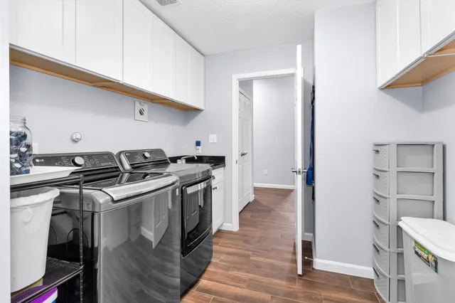 a kitchen with a stove and a refrigerator